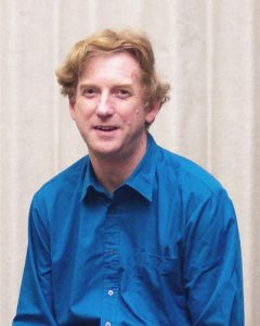 Photo of a clean shaven caucasian male in his 40's in a blue shirt, Jim Drummond PI of MOPITT